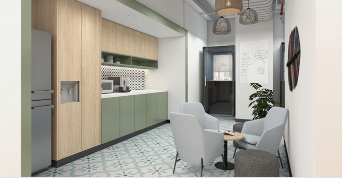 Breakout zone in a workplace with coffee area, dining tables, and casual seating for employees
