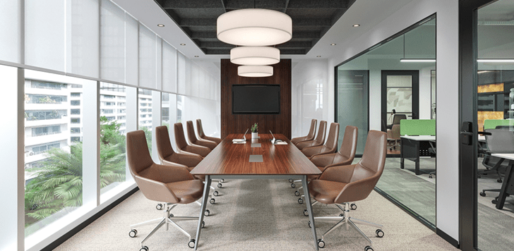 Large conference room featuring boardroom table, ergonomic chairs, acoustic panels, and a wall-mounted screen in a professionally designed office fit-out
