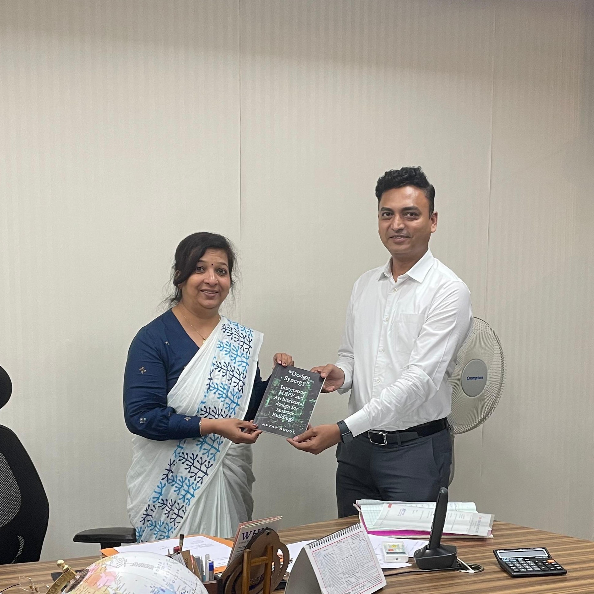 Book presentation to Dr. Shaila Bantanur